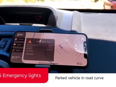 V-16 (Emergency Lights): Parked vehicle in road curve